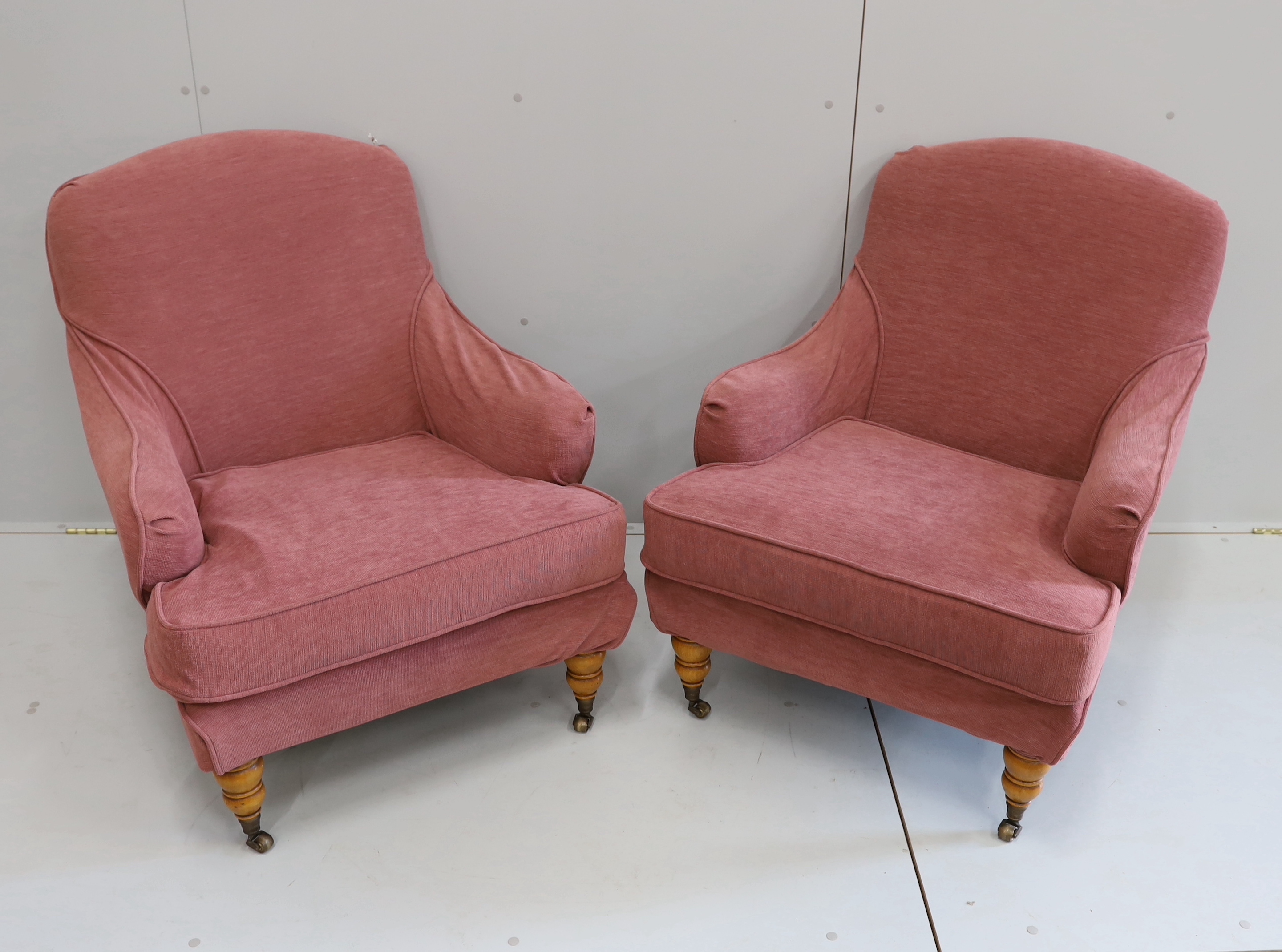 A pair of modern French upholstered armchairs, silk covered with later loose covers, width 74cm, depth 80cm, height 87cm